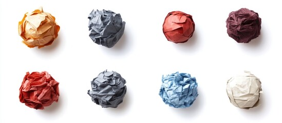 Colorful crumpled paper balls arranged in a grid on a white background Copy Space