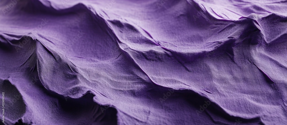 Poster close-up detail of crumpled purple fabric texture with soft folds and shadows suitable for backgroun