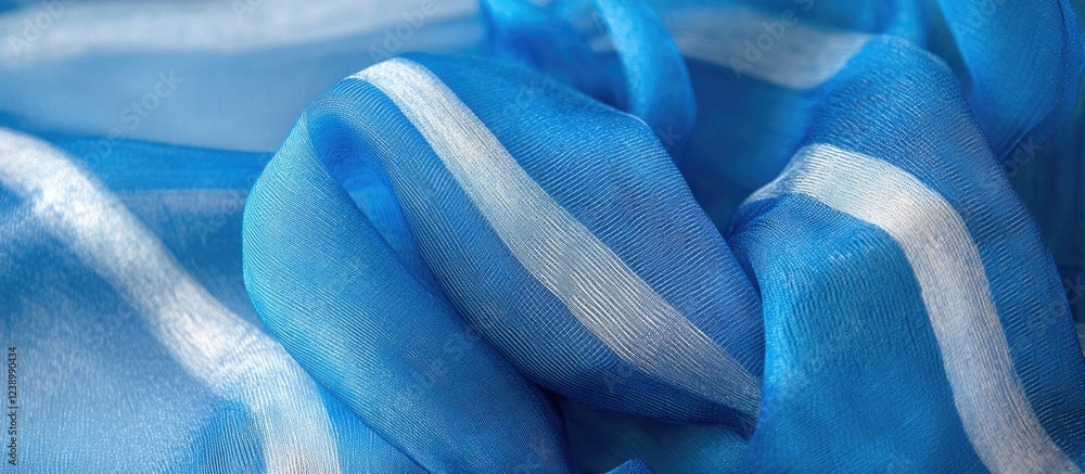 Poster blue sheer fabric with soft white stripes draped elegantly creating a flowing texture detailed close