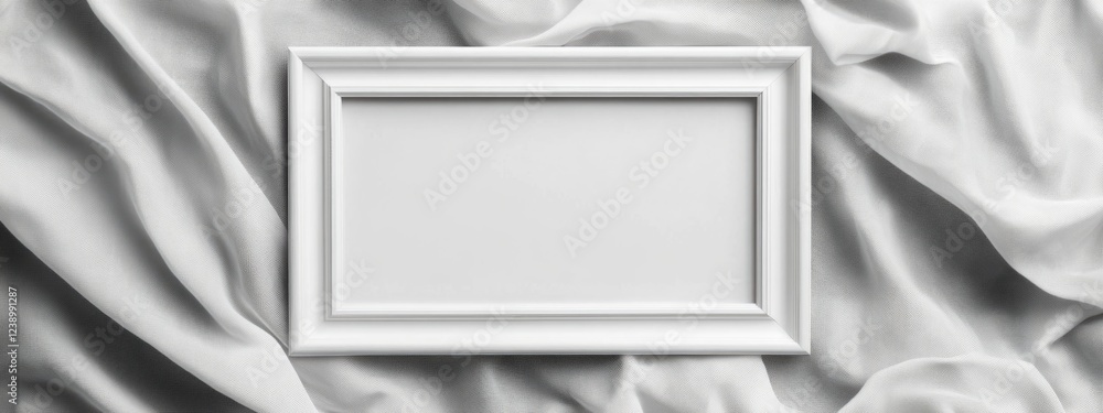 Poster white photo frame on soft white fabric background with textured folds and ample copy space for desig