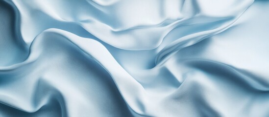 Obraz premium Blue satin fabric texture with soft creases and smooth surface ideal for background use and Copy Space.