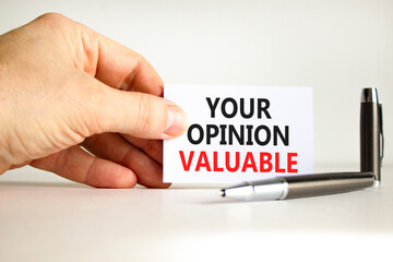 Your opinion valuable symbol. Concept words Your opinion valuable on beautiful white card. Beautiful white background. Businessman hand. Business your opinion valuable concept. Copy space.