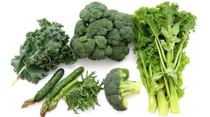 Fresh organic green vegetables isolated on white background with kale, broccoli, collard greens and parsley, cucumbers, asparagus