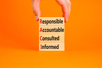 RACI symbol. Concept word RACI Responsible Accountable Consulted Informed on wooden blocks....