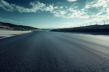 Fototapeta premium An Empty Asphalt Race Track for Motorsport, Capturing the Quiet Majesty and Vast Expanse of a Deserted Circuit under a Brooding Sky