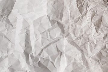 Crumpled white paper background.
