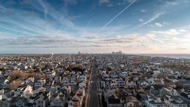 Aerial drone view of Margate City looking at Atlantic City in the distance. - Powered by Adobe