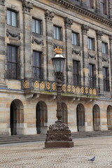 Amsterdam Dam Square Historic Lamppost with Royal Palace Facade, Netherlands