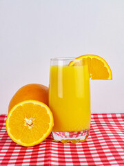 glass of orange juice on a white background
