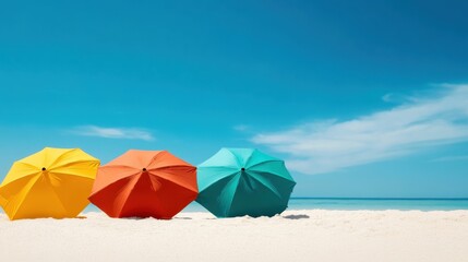 Three colorful beach umbrellas (yellow, orange, and teal) create a bright and cheerful atmosphere on a sunny beach, inviting relaxation and enjoyment by the sea.