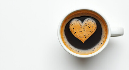 A white cup of black coffee showcases a heart-shaped foam design on top. The cup is placed against a clean, minimalist background, creating a warm and inviting ambiance perfect for morning rituals