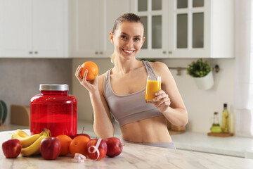 Weight loss. Happy woman with tasty shake and orange at white marble table in kitchen