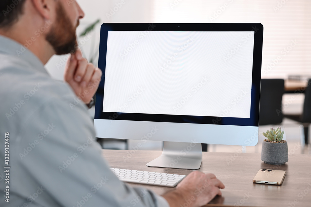 Poster man working on computer at table in office, closeup