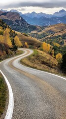Fototapeta premium Serene Autumnal Road Winding Through Majestic Mountains