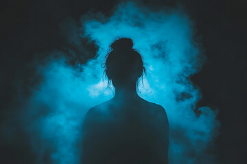 A mysterious silhouette of a woman standing behind frosted glass, creating an artistic and atmospheric effect.