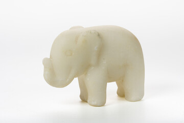 Old vintage souvenir marble elephant on white background. Vintage interior items.