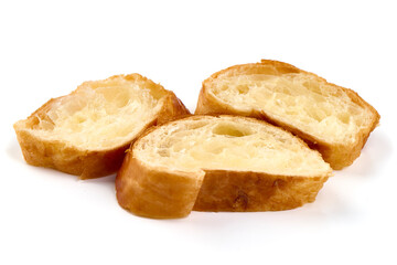 Freshly baked baguette slices, isolated on white background.