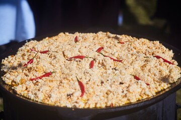 The national dish is hominy porridge with hot pepper. Festive presentation. The national cuisine of the peoples of the Caucasus