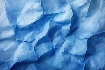 Obraz premium Crumpled blue paper texture with white distressed border
