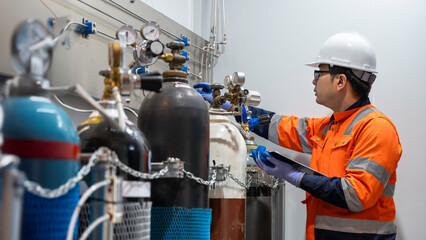 Asian engineer working at Operating hall,Thailand people wear helmet  work,He worked with diligence...