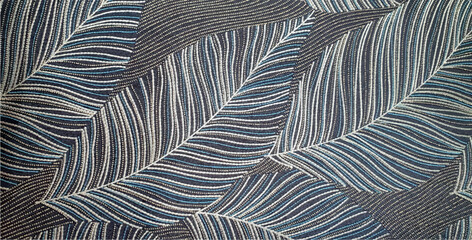 Abstract decor from leaves in gray tones. Texture wallpaper gray leaves interior design. Texture of fabric leaves in gray shades. Leafy background with geometric lines.