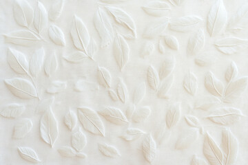 Intricate textures of white leaves arranged on a soft surface for a serene visual experience