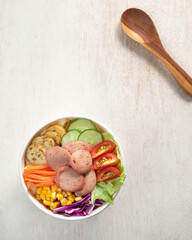 Salad, A vibrant salad bowl filled with fresh vegetables, including lettuce, carrots, tomatoes, cucumber, and corn. The salad is prepared with care
