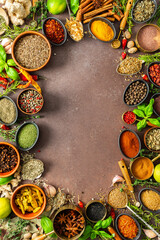 A colorful assortment of fragrant herbs and spices on a warm brown background, showcasing their visual variety and aromatic appeal, spice frame