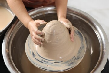 Hobby and craft. Girl making pottery indoors, closeup