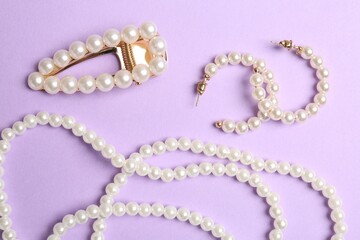 Stylish accessories on lilac background, flat lay