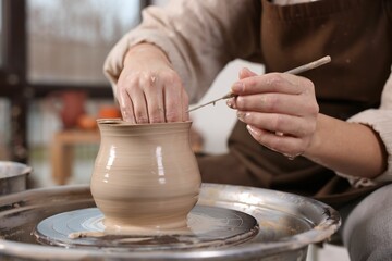 Hobby and craft. Woman making pottery indoors, closeup