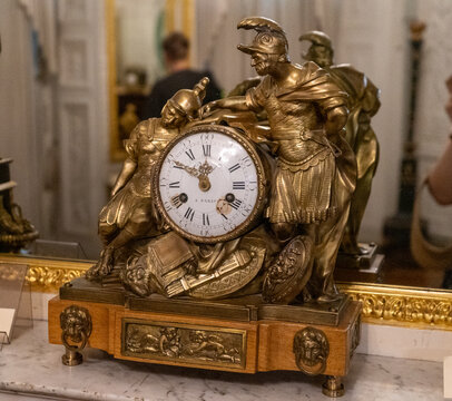 Old gold watch Clock from France. Soldiers. Ukraine, Lviv - August 12, 2024