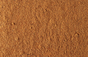 Milled nutmeg, powder background and texture