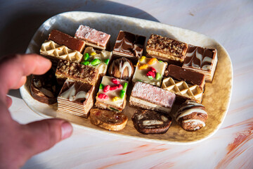 Small sweet cakes arranged on a plate