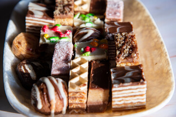 Small sweet cakes arranged on a plate