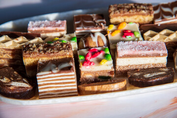 Small sweet cakes arranged on a plate