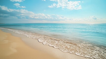 Tranquil Beach Scene with Soft Waves and Clear Blue Sky
