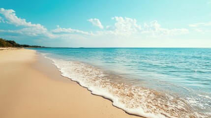 Tranquil Beach Scene with Gentle Waves and Clear Blue Skies