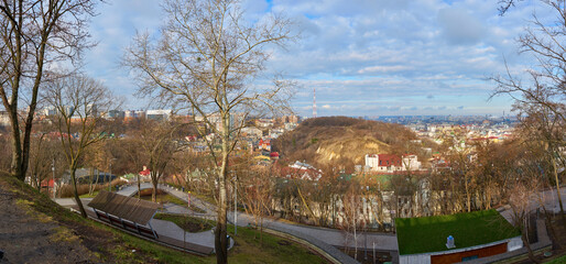 Panoramic View of Podil Kyiv – Scenic Cityscape from Hilltop Overlook with Historic Architecture, Urban Landscape and Cloudy Sky
