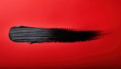 Black paint brush on red background