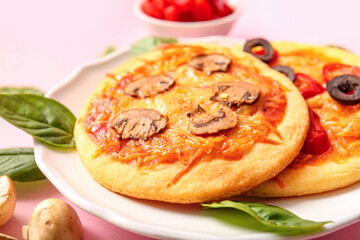 Plate with different tasty mini pizzas, closeup