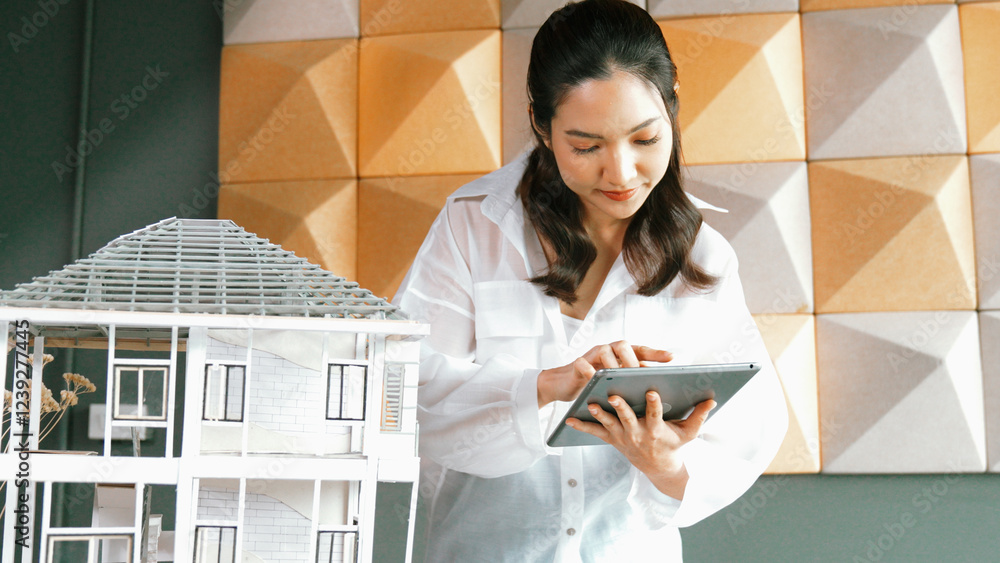 Poster beautiful project manager using tablet check house model. portrait of architect engineer inspect bui
