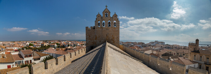 The bell tower of the Church of the Saintes Maries de la Mer , a Romanesque fortified church built in the 9th century in Saintes-Maries-de-la-Mer in Camargue