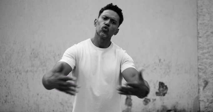 Man arguing directly with camera, intense expression, pointing hand, confrontation, conflict, disagreement, frustration, assertiveness, strong emotions, tension, direct engagement