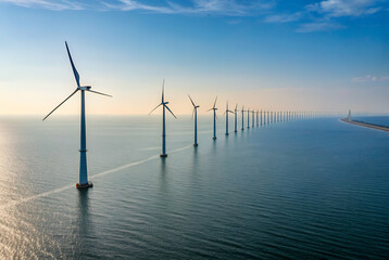 Offshore Wind Farm Aerial View of Numerous Wind Turbines in a Calm Blue Ocean Under a Bright Sky