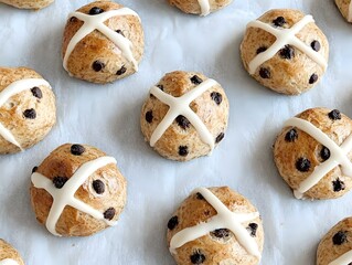 Mini Chocolate Chip Hot Cross Buns:  A close-up shot of a baking sheet filled with miniature chocolate chip hot cross buns.
