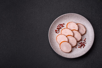 Delicious fresh ham cut into round slices with salt, spices and herbs