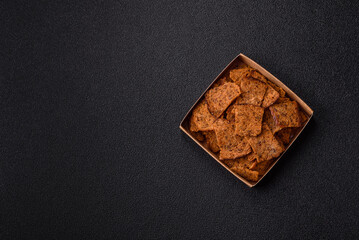 Crispy homemade brown bread chips with seeds and grains