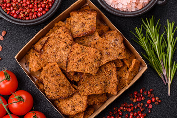 Crispy homemade brown bread chips with seeds and grains