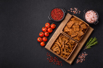 Crispy homemade brown bread crackers or croutons with seeds and grains